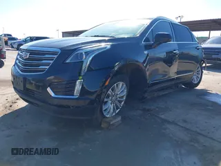 2019 Cadillac XT5 FWD with VIN 1GYKNARS7KZ117913, listed as a IAAI auction lot 41228767 with 105,335 mi miles and . Bid and sale history available at carsss.com. Image 2.