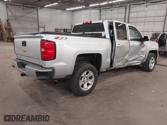 2017 Chevrolet Silverado 1500 LT with VIN 3GCUKREC5HG318772, listed as a IAAI auction lot 42056116 with 82,987 mi miles and . Bid and sale history available at DreamBid. Image 4.