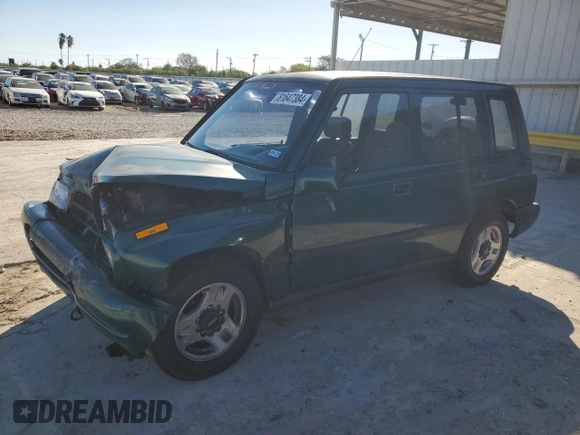 1996 Geo Tracker z VIN 2CNBE1363T6921541, wystawiony jako Copart lot #81647384 z przebiegiem 61 806 mil mil oraz Szkoda całkowita • Salvage title. Historia ofert i sprzedaży dostępna na DreamBid. Obrazek 1.