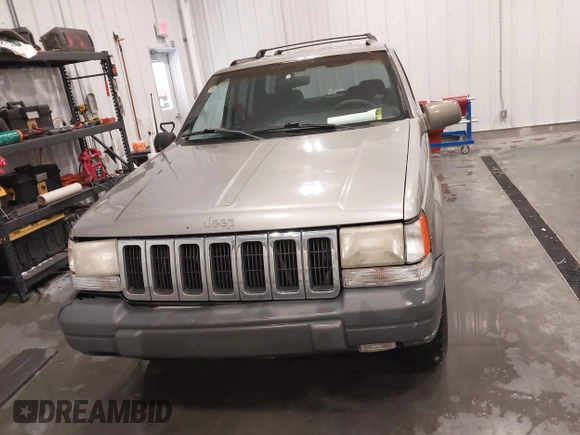 1998 Jeep Grand Cherokee Laredo with VIN 1J4GZ58S3WC343555, listed as a IAAI auction lot 41528943 with 219,146 mi miles. Bid and sale history available at carsss.com. Image 13.