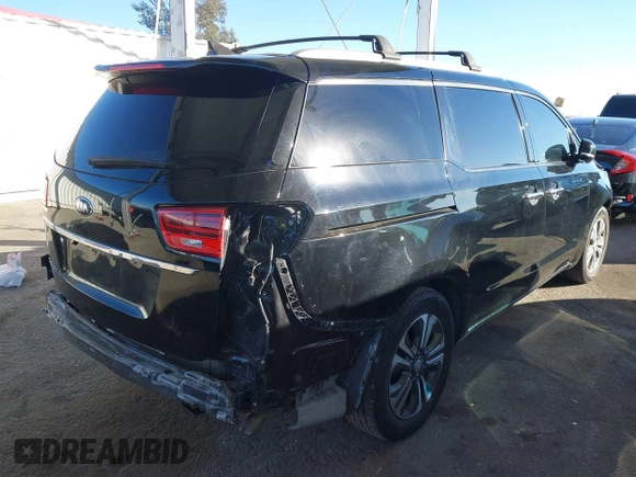 2021 Kia Sedona EX with VIN KNDMC5C10M6671729, listed as a IAAI auction lot 40858206 with 58,775 mi miles. Bid and sale history available at carsss.com. Image 4.