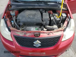 2012 Suzuki SX4 LE with VIN JS2YC5A34C6300079, listed as a Copart auction lot 68414434 with 111,661 mi miles and Salvage Title. Bid and sale history available at carsss.com. Image 13.