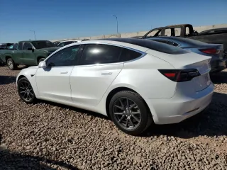 2020 Tesla Model 3 Standard Range Plus with VIN 5YJ3E1EA4LF799597, listed as a Copart auction lot 76401374 with 77,506 mi miles and Salvage Title. Bid and sale history available at DreamBid. Image 2.