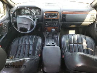1999 Jeep Grand Cherokee Limited with VIN 1J4GW68SXXC581130, listed as a Copart auction lot 43532245 with 265,886 mi miles and Salvage Title. Bid and sale history available at carsss.com. Image 8.