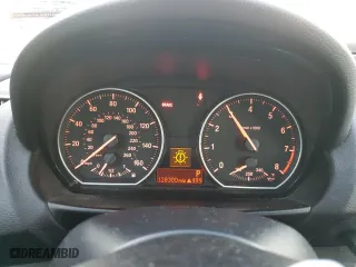 2011 BMW 1 Series 135i with VIN WBAUC9C59BVM10741, listed as a Copart auction lot 79583304 with 128,300 mi miles and Salvage Title. Bid and sale history available at carsss.com. Image 9.