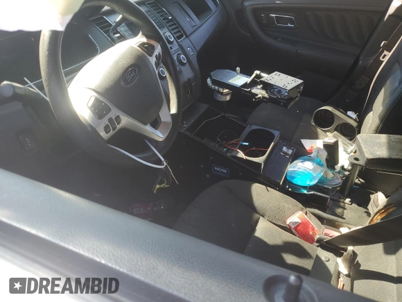 2015 Ford Police Interceptor with VIN 1FAHP2L80FG167962, listed as a Copart auction lot 77085564 with 121,447 mi miles and Salvage title. Bid and sale history available at DreamBid. Image 7.