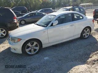 2013 BMW 1 Series 128i with VIN WBAUP7C54DVP24583, listed as a Copart auction lot 77454984 with 114,358 mi miles and Salvage Title. Bid and sale history available at carsss.com. Image 1.