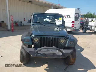 2002 Jeep Wrangler Sport with VIN 1J4FA49S52P760173, listed as a IAAI auction lot 42468550 with 201,682 mi miles and . Bid and sale history available at DreamBid. Image 12.