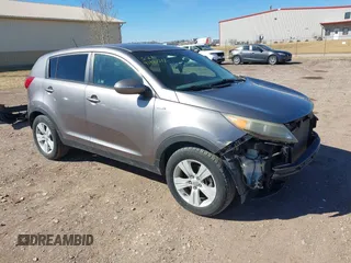 2012 Kia Sportage LX with VIN KNDPBCA27C7318056, listed as a IAAI auction lot 41887312 with 144,940 mi miles and . Bid and sale history available at DreamBid. Image 1.