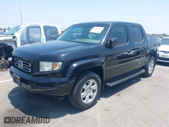 2006 Honda Ridgeline RTL with VIN 2HJYK16576H566002, listed as a IAAI auction lot 42595698 with 212,637 mi miles and . Bid and sale history available at DreamBid. Image 2.