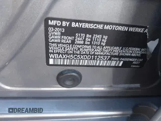 2013 BMW 5 Series 528i xDrive with VIN WBAXH5C5XDD112537, listed as a IAAI auction lot 40585977 with 999,999 mi miles. Bid and sale history available at carsss.com. Image 9.