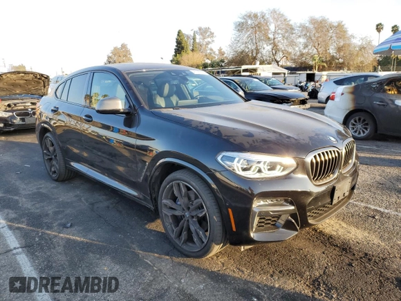 2020 BMW X4 M40i with VIN 5UX2V5C0XL9B53828, listed as a Copart auction lot 43190795 with 55,374 mi miles and Salvage title. Bid and sale history available at DreamBid. Image 4.