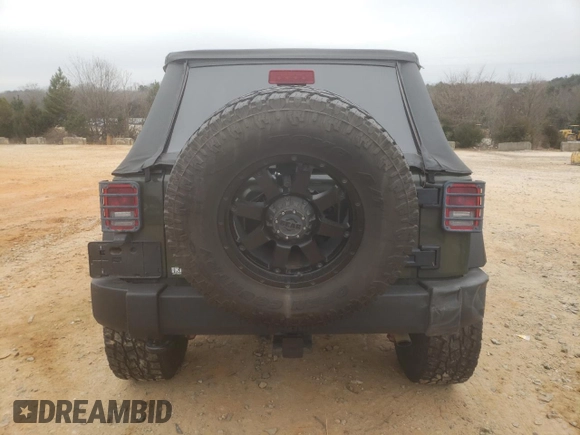 2015 Jeep Wrangler Unlimited Rubicon with VIN 1C4BJWFG3FL667908, listed as a Copart auction lot 89116445 with 75,996 mi miles and Salvage title. Bid and sale history available at DreamBid. Image 6.