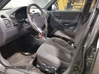 2000 Hyundai Accent z VIN KMHCG45G4YU090520, wystawiony jako Copart lot #79705864 z przebiegiem 145 490 mil mil oraz Szkoda całkowita • Salvage title. Historia ofert i sprzedaży dostępna na DreamBid. Obrazek 7.
