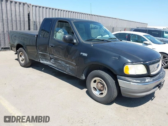 2003 Ford F-150 XL with VIN 1FTRX17213NB70553, listed as a IAAI auction lot 41946968 with 186,683 mi miles. Bid and sale history available at carsss.com. Image 1.