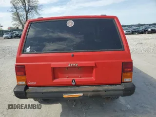 1995 Jeep Cherokee SE with VIN 1J4FT27P9SL561969, listed as a Copart auction lot 53295865 with 151,377 mi miles and Salvage title. Bid and sale history available at DreamBid. Image 6.