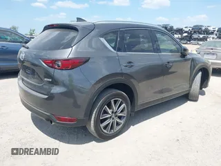 2017 Mazda CX-5 Grand Touring with VIN JM3KFADL3H0227655, listed as a IAAI auction lot 41897981 with 103,545 mi miles. Bid and sale history available at carsss.com. Image 4.