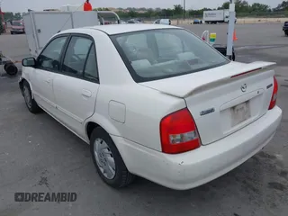 2000 Mazda Protege DX with VIN JM1BJ2220Y0273953, listed as a IAAI auction lot 41956058 with 158,837 mi miles and . Bid and sale history available at DreamBid. Image 3.