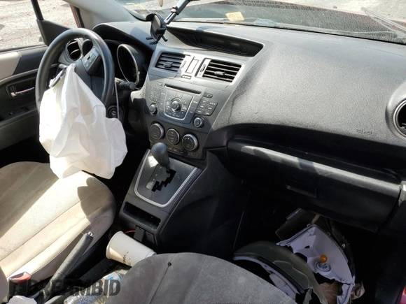 2012 Mazda 5 Sport with VIN JM1CW2BL4C0128082, listed as a Copart auction lot 67080914 with Not Provided miles and Salvage Title. Bid and sale history available at DreamBid. Image 8.
