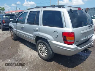 2004 Jeep Grand Cherokee Limited with VIN 1J4GW58N64C283657, listed as a IAAI auction lot 42542150 with 228,910 mi miles and . Bid and sale history available at DreamBid. Image 3.