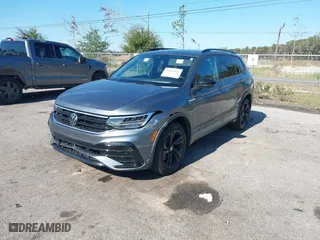 2023 Volkswagen Tiguan SE R-Line Black with VIN 3VVCB7AX7PM132001, listed as a IAAI auction lot 41042085 with 15,007 mi miles. Bid and sale history available at carsss.com. Image 2.