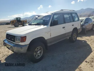 1995 Mitsubishi Montero z VIN JA4MR41H3SJ004800, wystawiony jako Copart lot #72036354 z przebiegiem 209 635 mil mil oraz Szkody całkowita. Historia ofert i sprzedaży dostępna na DreamBid. Obrazek 1.