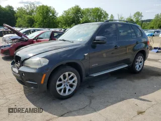 2012 BMW X5 35i with VIN 5UXZV4C59CL752661, listed as a Copart auction lot 58590305 with 101,725 mi miles and Salvage title. Bid and sale history available at DreamBid. Image 1.