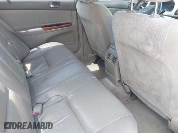 2002 Toyota Camry XLE z VIN 4T1BF32K42U035090, wystawiony jako IAAI lot #42250135 z przebiegiem 176 364 mil mil oraz . Historia ofert i sprzedaży dostępna na DreamBid. Obrazek 8.