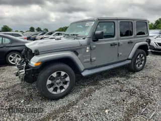 2018 Jeep Wrangler Unlimited Sahara with VIN 1C4HJXEN5JW290098, listed as a Copart auction lot 64794695 with 71,462 mi miles and Salvage title. Bid and sale history available at DreamBid. Image 1.
