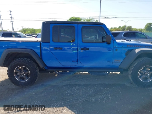 2023 Jeep Gladiator Rubicon with VIN 1C6JJTBG3PL581023, listed as a IAAI auction lot 41963931 with 15,023 mi miles and . Bid and sale history available at DreamBid. Image 14.