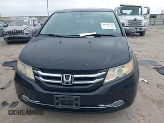 2014 Honda Odyssey Touring with VIN 5FNRL5H9XEB045695, listed as a IAAI auction lot 41545348 with 131,472 mi miles and . Bid and sale history available at carsss.com. Image 12.