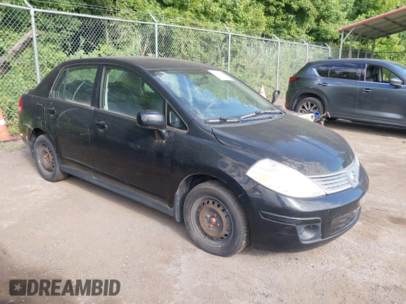 2009 Nissan Versa 1.8 S with VIN 3N1BC11E39L497791, listed as a IAAI auction lot 39679827 with 113,244 mi miles. Bid and sale history available at carsss.com. Image 1.