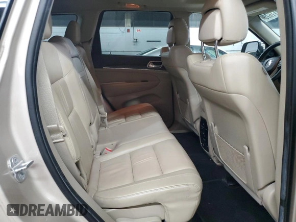 2014 Jeep Grand Cherokee Limited z VIN 1C4RJFBG1EC148908, wystawiony jako Copart lot #54311675 z przebiegiem 90 886 mil mil oraz Szkoda całkowita • Salvage title. Historia ofert i sprzedaży dostępna na DreamBid. Obrazek 11.
