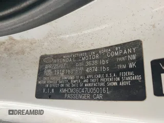 2007 Hyundai Accent GS with VIN KMHCM36C47U050161, listed as a IAAI auction lot 41762927 with 111,684 mi miles. Bid and sale history available at carsss.com. Image 9.