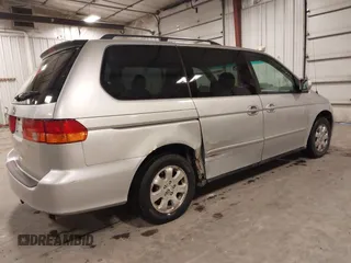 2004 Honda Odyssey EX-L with VIN 5FNRL18974B127696, listed as a IAAI auction lot 41643243 with 200,286 mi miles and . Bid and sale history available at DreamBid. Image 4.