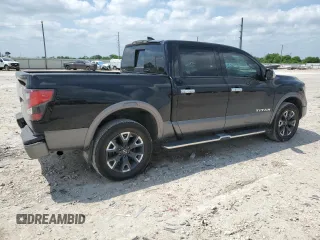 2023 Nissan Titan Platinum Reserve with VIN 1N6AA1EDXPN106467, listed as a Copart auction lot 53455215 with 56,061 mi miles and Salvage title. Bid and sale history available at DreamBid. Image 3.