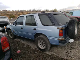 1992 Isuzu Rodeo z VIN 4S2CY58Z2N4333410, wystawiony jako Copart lot #74507154 z przebiegiem 264 327 mil mil oraz Szkody całkowita. Historia ofert i sprzedaży dostępna na DreamBid. Obrazek 2.