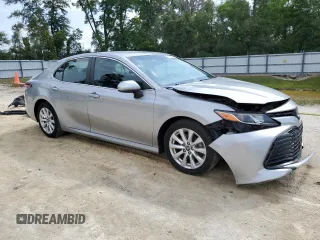 2018 Toyota Camry LE z VIN 4T1B11HK3JU525478, wystawiony jako Copart lot #56112235 z przebiegiem 141 609 mil mil oraz Szkoda całkowita • Salvage title. Historia ofert i sprzedaży dostępna na DreamBid. Obrazek 4.