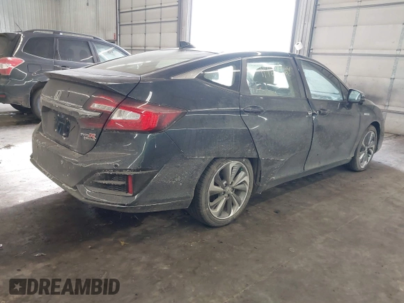 2018 Honda Clarity Touring z VIN JHMZC5F39JC002521, wystawiony jako IAAI lot #41428968 z przebiegiem 64 014 mil mil oraz . Historia ofert i sprzedaży dostępna na DreamBid. Obrazek 4.