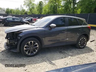 2016 Mazda CX-5 Grand Touring z VIN JM3KE4DY8G0776573, wystawiony jako Copart lot #55503005 z przebiegiem 88 947 mil mil oraz Szkoda całkowita • Salvage title. Historia ofert i sprzedaży dostępna na DreamBid. Obrazek 1.