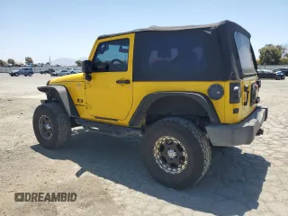 2008 Jeep Wrangler X with VIN 1J4FA24188L567678, listed as a Copart auction lot 60918635 with 185,368 mi miles and Salvage title. Bid and sale history available at DreamBid. Image 2.