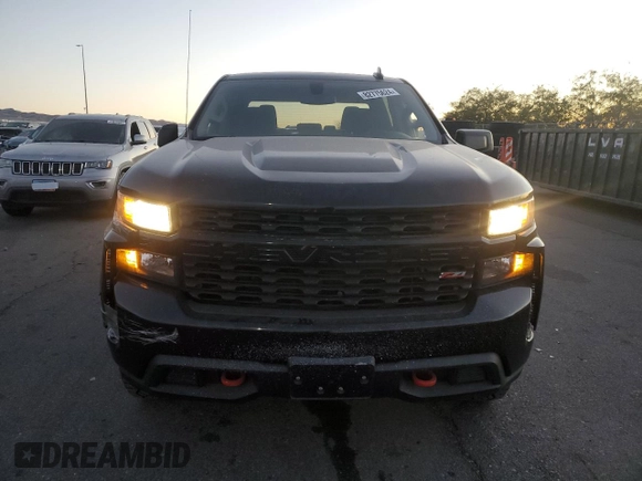 2021 Chevrolet Silverado 1500 Custom Trail Boss with VIN 3GCPYCEF6MG104130, listed as a Copart auction lot 82775624 with 62,408 mi miles and Salvage Title. Bid and sale history available at DreamBid. Image 5.