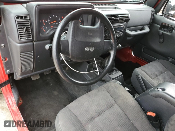 2005 Jeep Wrangler Sport z VIN 1J4FA49S75P317995, wystawiony jako Copart lot #58060055 z przebiegiem 189 332 mil mil oraz Szkoda całkowita • Salvage title. Historia ofert i sprzedaży dostępna na DreamBid. Obrazek 8.