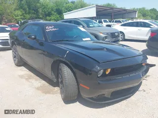 2023 Dodge Challenger SXT with VIN 2C3CDZAG3PH586933, listed as a IAAI auction lot 42001266 with 38,097 mi miles. Bid and sale history available at carsss.com. Image 1.