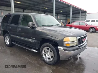 2005 GMC Yukon SLT with VIN 1GKEC13T75R144645, listed as a IAAI auction lot 41703999 with 222,585 mi miles. Bid and sale history available at carsss.com. Image 1.