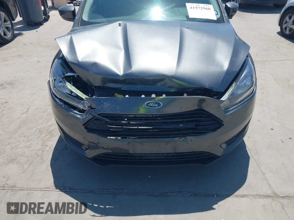 2018 Ford Focus SE with VIN 1FADP3FE3JL204220, listed as a IAAI auction lot 41972960 with 62,682 mi miles and . Bid and sale history available at DreamBid. Image 17.