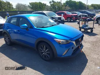 2017 Mazda CX-3 Touring z VIN JM1DKDC74H0145372, wystawiony jako IAAI lot #41805299 z przebiegiem 62 491 mil mil oraz . Historia ofert i sprzedaży dostępna na DreamBid. Obrazek 1.