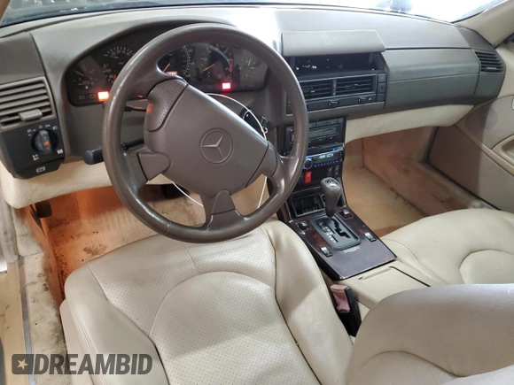 1997 Mercedes-Benz SL 500 with VIN WDBFA67F5VF147986, listed as a Copart auction lot 84255574 with 158,607 mi miles and Salvage title. Bid and sale history available at DreamBid. Image 8.