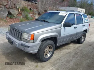 1996 Jeep Grand Cherokee Laredo with VIN 1J4EX58S1TC122268, listed as a IAAI auction lot 42005236 with 288,466 mi miles. Bid and sale history available at carsss.com. Image 2.