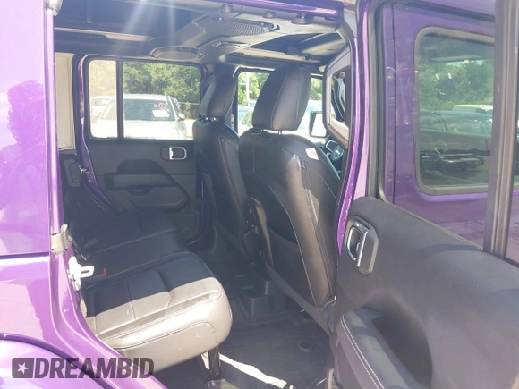 2023 Jeep Wrangler High Altitude z VIN 1C4HJXEN9PW560958, wystawiony jako IAAI lot #42393559 z przebiegiem 35 981 mil mil oraz . Historia ofert i sprzedaży dostępna na DreamBid. Obrazek 8.